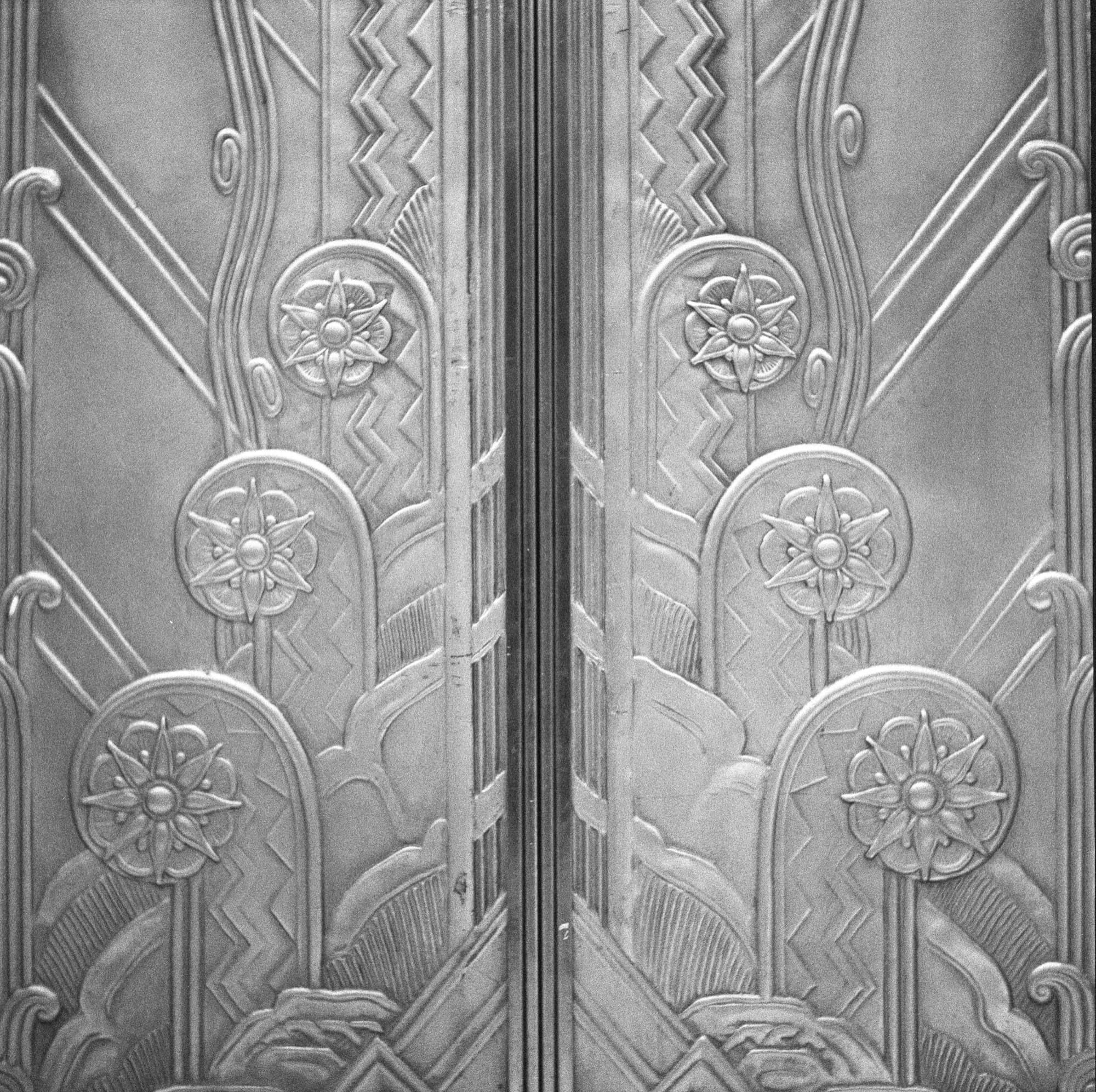 Art Deco elevator doors at Nester Finn Financial District, shot on Rolleiflex