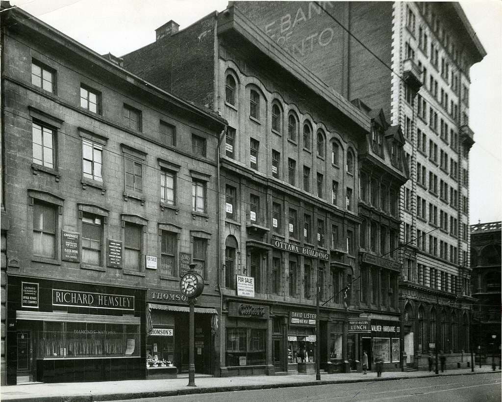 Historic streetscape of brick and stone buildings near Nester Finn Square Victoria in Montréal, including the former Ottawa Hotel