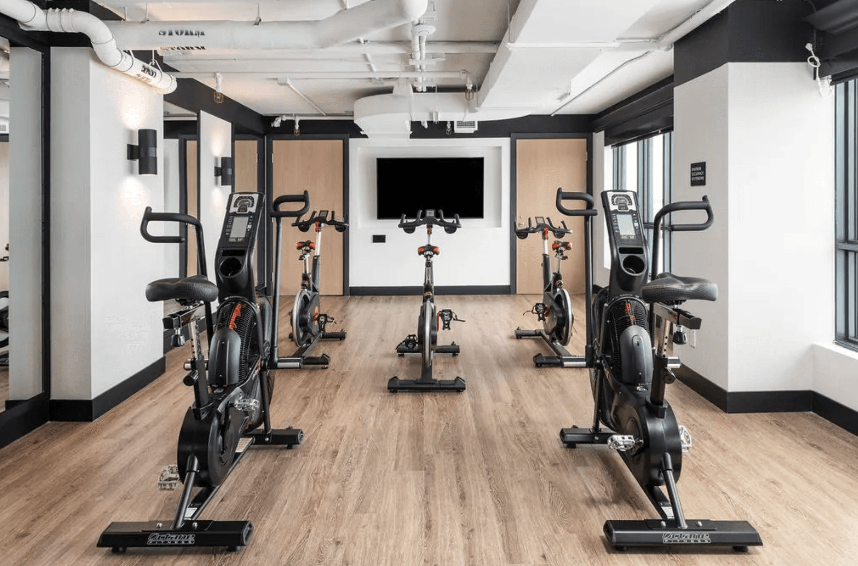 West Queen West fitness area with modern workout equipment and bright interiors